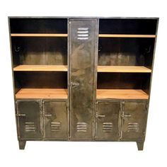 an old metal bookcase with two open doors and drawers on one side, in front of a white background