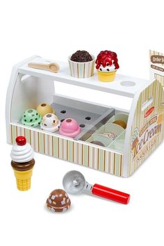 a toy ice cream shop with cupcakes and other treats