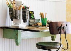 an old fashioned desk with office supplies on it