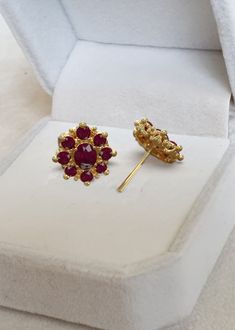 Handmade 925 Sterling Silver with 18 K Gold Plating, flower studs with natural ruby gemstones, Ruby Studs, Ruby Small Stud Earrings, Stud Earrings, July Birthstone, Ruby Earrings, Ruby is a fine durable substance that can be worn daily as rings, Made to be tough and durable, Rubies do not require any special care We are Love Ruby Found something you love Ruby July Birthstone, Ruby Earrings, ... Natural Red Ruby Earrings, Silver With 18K White Gold Plating, July Birthstone, Handmade Engagement Gift for Women Her....  Check out  DETAILS * Gemstone: Center stone : Natural Red Ruby 0.35  Ct * Side Stone : Natural Red Ruby 0.38Ct  * Face Dimension 8MM  * Metal: 925 Sterling Silver with 18K Gold Plating 925 silver setting with White Gold Platting  This is a gorgeous handmade creation. Its beauty Ruby Earrings With Prong Setting, Ruby Flower-shaped Jewelry For Anniversary, Ruby Jewelry In Flower Shape For Anniversary, Flower-shaped Ruby Jewelry For Anniversary, Red Cluster Earrings With Prong Setting As Gift, Red Prong Setting Cluster Earrings For Gift, Ruby Gemstone Earrings In Temple Jewelry Style, Ruby Gemstone Temple Jewelry Earrings, Thailand Jewelry