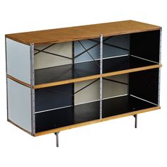 a wooden and metal cabinet with three shelves on each side, one shelf is black and the other is white