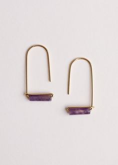 An easy-to-wear elegant drop earring. Amazonite bead to bring about a hopeful look. Amethyst bead to bring about overall wellness and enhance spiritual growth. Brass setting with 18kt gold plating The gemstone bead measures 13mm x 4mm Earring height 33mm Natural stones will show variation in tones and color; no two are alike. Made in United States Gemstone Earrings Handmade, Bubble Earrings, Earrings Beads, Gemstone Drop Earrings, Amethyst Beads, Drop Earring, Jewelry Inspo, Hippie Chic, Amethyst Gemstone