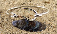 Sterling Silver Fish Hook Bracelet with 14 Karat Gold Twisted Wrap Made in our shop Free First Class Insured Shipping Comes Nicely Gift Boxed Camden Maine, Fish Hook Bracelet, Hook Bracelet, Silver Fish, Garden Jewelry, Fish Hook, Precious Metals, Maine, Jewelry Watches