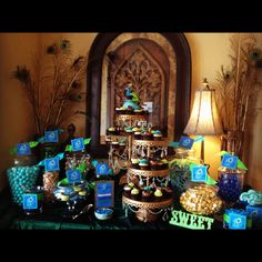 an image of a table full of desserts and candies for a birthday party