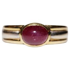 In very good condition. Total weight is 7.1 grams. Totally is ruby about 2 carat. Ring size is US 6. We can make any size. Box is not included. Please contact for any questions. Yellow Gold Cabochon Ruby Ring, Gold Ruby Ring Oval Cabochon With Polished Finish, Fine Jewelry Cabochon Ruby Ring In Yellow Gold, Fine Jewelry Ruby Ring In Yellow Gold With Cabochon, Cabochon Ruby Ring In Yellow Gold, Yellow Gold Ruby Signet Ring With Polished Finish, Formal Ruby Signet Ring With Bezel Setting, Ruby Signet Ring With Bezel Setting For Formal Occasions, Formal Cabochon Ruby Ring