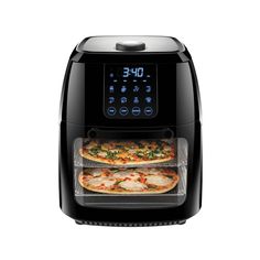 two pizzas being cooked in an air fryer with the timer on it's side