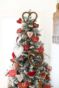 a christmas tree decorated with red and white hearts