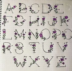 the letters and numbers are drawn with flowers on them, as well as dots in the paper