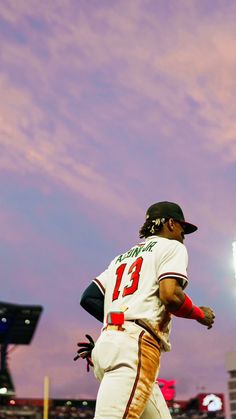 a baseball player is running on the field