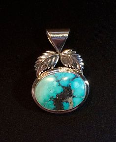 "This Custom, hand made Gem High-Grade Old Stock Kingman Turquoise Sterling Silver Pendant weighs 9.15 grams. The cabochon weight is 15.6 Ct. and is unbacked. The pendant Measures approximately 1 5/8\" long including bale and 1 1/16\" wide. The stone measures approximately 23.3 mm, by 18 mm, by 4.4 mm * IF YOU ARE LOOKING FOR MORE OF MY TURQUOISE JEWELRY PLEASE DO A GOOGLE SEARCH FOR higradeturquoise.com Following numerous requests from those of you that do not have a jeweler. I will now offer f Elegant Handmade Turquoise Chrysocolla Necklace, Unique Polished Turquoise Necklace, Artisan Turquoise Jewelry With Polished Finish, Unique Turquoise Jewelry With Polished Finish, Untreated Chrysocolla Turquoise Jewelry, Sterling Silver Turquoise Oval Cabochon Jewelry, Artisan Turquoise Cabochon Oval Pendant Necklace, Artisan Turquoise Necklace With Oval Cabochon Pendant, Oval Turquoise Jewelry For Jewelry Making