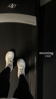 the feet of a person standing on top of a black and white object with text reading morning thru