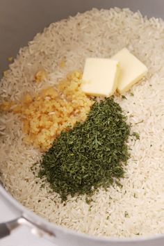 rice, butter and herbs in a pot