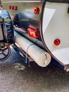 the back end of an rv with its trailer attached to it