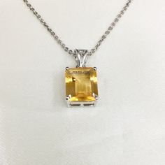 PRODUCT INFO : Stone : Natural Citrine Stone size : 10x12 mm Product Length : 2.25 Metal type : Sterling silver (92.5) Approximate weight : 2.33 grams ABOUT CITRINE GEMSTONE : CITRINES have been valued for their beauty and brilliance. They remind us of the bright, warm sun and the vitality of life. Their vibrant yellow color and shining clarity often represent a healthy mind and body as well as happiness and success. These stones evoke images of sunny warmth and illumination, and it's no surpris Octagon-shaped Citrine Jewelry For Anniversary, Octagon Shaped Citrine Jewelry For Anniversary, Octagon Citrine Jewelry For Anniversary, Emerald Cut Jewelry With Polished Finish As Gift, Silver Octagon Birthstone Jewelry, Silver Octagon Jewelry With Birthstone, Hallmarked Octagon Sterling Silver Jewelry, Octagon Citrine Jewelry For Gifts, Faceted Citrine Jewelry As Gift