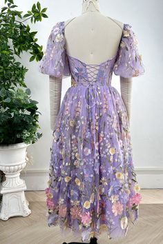 Elevate your style with our Corset Lavender Floral Embroidery Midi Dress. Featuring delicate floral embroidery and elegant puff sleeves, this piece combines femininity and sophistication. Embrace luxury in this exclusive dress. Bust and Skirt with full lining. 100% Polyester 100% Recycled polyester lining Concealed zip at center back Imported Lavender Party Dress With Floral Embroidery, Fitted Lavender Embroidered Dress, Lavender Floral Embroidered Dress For Party, Lavender Floral Applique Dress For Spring, Lavender Floral Embroidery Party Dress, Spring Wedding Puff Sleeve Knee-length Dress, Spring Wedding Knee-length Puff Sleeve Dress, Lavender Floral Embroidered Dress For Spring, Embroidered Lavender Dress For Spring