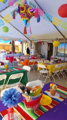 colorful tables and chairs are set up for a party