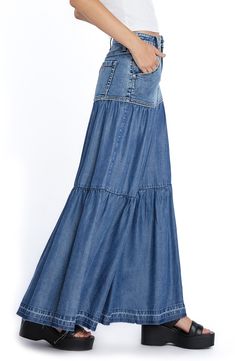 Perfect your casual-cool vibe in this denim maxi skirt designed with flouncy tiered ruffles. 37 1/2" center front length (size 29) Unlined 66% cotton, 22% REPREVE® recycled polyester, 8% polyester, 3% rayon, 1% spandex Machine wash, tumble dry Imported Casual Fitted Tiered Maxi Skirt, Chic Denim Tiered Skirt, Medium Wash Tiered Denim Skirt, Flowy Denim Tiered Skirt, Spring Full-length Bottoms With Ruffled Skirt, Full-length Ruffled Skirt For Spring, Full Length Ruffled Skirt Bottoms For Spring, Flowy Tiered Denim Skirt, Full Length Ruffled Skirt For Spring