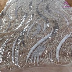 Price: The price is for 1 yard. if you buy more than 1 yard ,it won't be cut. will come in one piece the longest is 20 yards. Material: polyester,pearls,sequins,beads Fixed Wide : 125cm or 49 inches. color:off white,silver Want to see other colors and more similar Beading lace fabrics come to: https://www.etsy.com/shop/Randyfabrics?ref=hdr_shop_menu&section_id=14192305 Shipping: Choose the shipping way you need, if you want package shipped by express,please note the phone number on order. Us Elegant Silver Lace With Sequins, Fitted Silver Lace For Party, Elegant Silver Lace Tulle Fabric, Silver Embellished Lace Tulle Fabric, Embellished Silver Lace Tulle Fabric, Silver Fitted Lace Sequin Fabric, Silver Sequin Fabric With Lace For Party, Silver Lace Sequin Fabric In Glamorous Style, Silver Sequin Fabric With Lace Work For Party