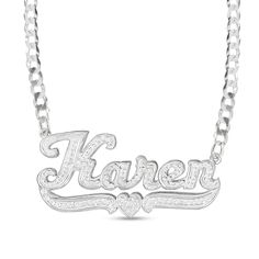 Create a unique fashion statement with the personalized design of this diamond hammered underlined name plate necklace in silver. Crafted in sterling silver This choice features your name - from three to 10 characters in length - sculpted in a bold artful font. Scrolling ribbons and a heart detail underline your name. Diamonds and the hammered texture add shimmer and shine. This 1/15 ct. t.w. diamond look suspends centered along a curb chain that secures with a lobster claw clasp. 18.0-inch tota Engraved White Gold Custom Nameplate Necklace, Silver Customizable Nameplate Necklace, Engraved White Gold Nameplate Necklace, Silver Custom Nameplate Necklace, Silver Engraved Nameplate Necklaces, Personalized Silver Diamond Name Necklace, White Gold Nameplate Necklace, Silver Nameplate Custom Necklace, Custom Silver Nameplate Necklace