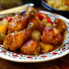 a white plate topped with chicken and vegetables