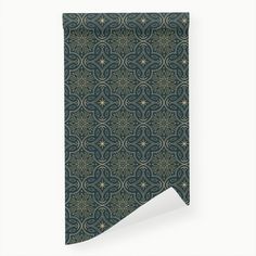 a green and gold wallpaper with an intricate design on it's side,