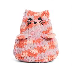 a crocheted bag with a cat face on the front and bottom, sitting in front of a white background