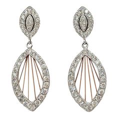 Beautiful dangle dream catcher design earrings with 1.18 ct. good quality white diamond rounds.  Handmade in 14k white and rose gold.  Metal: Gold Stone: White Diamond Stone Cut: Round Cut  Dimensions for the item are unknown. Please reach out in the seller Q&A with questions Diamond Chandelier Earrings For Pierced Ears, Fine Jewelry Diamond Chandelier Earrings, White Diamond Pierced Bridal Earrings, White Diamond Bridal Earrings, Pierced, White Diamond Chandelier Earrings For Pierced Ears, Dazzling Diamond Pierced Earrings, Diamond White Pierced Bridal Earrings, Diamond White Dangle Diamond Earrings, Diamond Chandelier Dangle Earrings