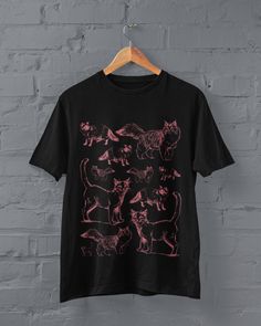 Grunge Cats T-shirt Printed on a super soft, cotton tee Dispatched in 5 working days or sooner Unisex Free UK delivery Material: 100% ringspun cotton. Chest (to fit): S  34/36   M  38   L  40/42   XL  44/46   XXL  48/50 ECO-FRIENDLY Each garment is made to order, reducing extra material and energy that would be otherwise wasted We use DTG printing process which is easier on the environment than screen-printing Our ink is bright and also eco-friendly. Do not tumble dry. Wash at 30 degrees c, insi Pink Grunge T-shirt With Screen Print, Pink Cotton Emo T-shirt, Emo Short Sleeve Top With Screen Print, Emo Style Short Sleeve Top With Screen Print, Black Emo Top With Screen Print, Pink Short Sleeve T-shirt For Alternative Fashion, Punk Style Black Tops With Funny Print, Black Punk Tops With Funny Print, Pink Emo Tops With Graphic Print