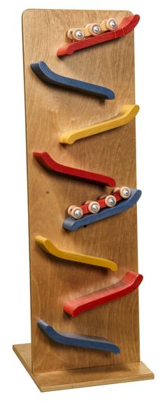 toothbrushes are lined up on a wooden display board with magnets attached to them