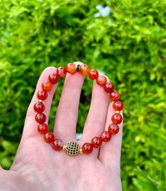 Amethyst has been long associated with the third eye and crown chakras. It symbolizes peace and calming energy and is said to quell anger and combat negativity. Red Carnelian Round Gold Center bead with black pace crystals, with Red Carnelian (8mm) and small brass spacers.  Note: stones may vary in coloring and brightness.  ♡ EXTRAS: Thank you so much for browsing my shop - it means so much to me! Please follow me on Instagram at @JewelsBuyJenny to see more and be the first to know about new lis Agate Gemstone Beaded Bracelets As Gift, Amber Gemstone Beaded Bracelets As Gift, Amber Gemstone Beaded Bracelet As Gift, Adjustable Carnelian Bracelet As A Gift, Adjustable Carnelian Bracelet Perfect For Gifts, Carnelian Round Beads Bracelet For Gift, Amber Carnelian Beaded Bracelets - Gift, Amber Crystal Bracelet With Gemstone Beads As Gift, Amber Agate Gemstone Bracelets