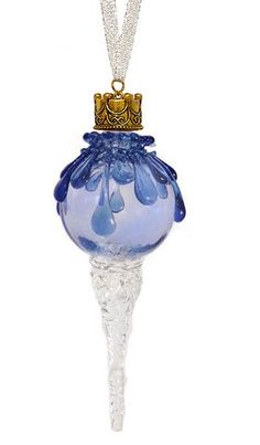 a blue glass ornament hanging from a chain