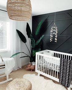 a baby's room decorated in black and white