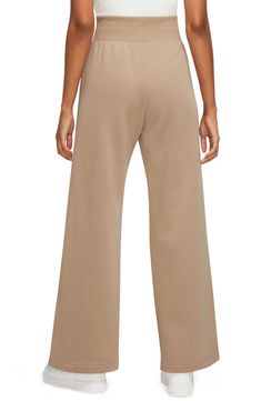 Get incredibly comfy in these wide-leg sweats with split hems so you can show off your favorite footwear. Taller ribbing at the waist, as well as an exaggerated drawcord, ensure the look is anything but basic. 28" inseam; 12" front rise (size Small) 80% cotton, 20% polyester Machine wash, tumble dry Imported Nike Full Length Sweatpants For Loungewear, Fall Sweatpants With Comfort Waistband, Leisure Wide Leg Pants For Fall, Sporty Relaxed Fit Wide Leg Pants For Fall, Comfortable Wide Leg Sweatpants For Fall, Nike Casual Wide Leg Bottoms, Comfort Waistband Wide Leg Pants For Lounging, Nike Sweatpants For Loungewear In Fall, Nike Sweatpants For Fall Loungewear