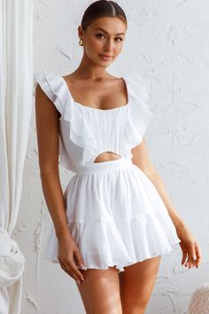 White romper Lined Ruffle trim detail Open back with string ties Zipper in back of shorts Make an entrance in our pretty Always My Girl romper. Perfect for Summer day pool parties teamed with wedges and a tote. We are obsessed with that open back with string-tie detail. You're sure to get noticed in this one! MODEL INFO Model is wearing size XS Height: 5'9" Bust: 34" Waist: 25" Hips: 37" GARMENT INFO Flat garment measurements This was manually measured from the actual garment Sizing may vary by Yellow Bridesmaid Dresses, Yellow Bridesmaids, Red Bridesmaids, Pool Parties, White Romper, Lace Bodycon Dress, Blue Bridesmaids, Date Night Dresses, Iron Material