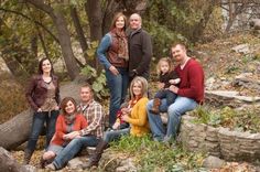 a group of people posing for a photo in the woods