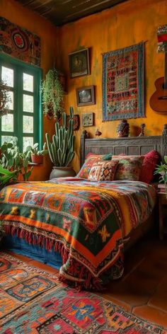 a bed room with a neatly made bed and potted plants