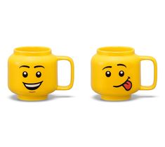 two yellow mugs with faces drawn on them