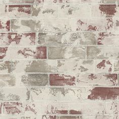 an old brick wall with red and white paint on it's sides, as well as some other colors