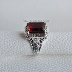 Gemstone-Garnet Shape-Rectangle Stone Size- 10x12 MM Metal-925 Sterling Silver This One of a kind ring is adorned with beautiful Garnet Gemstone set in sterling silver. About gemstones-Garnet is intense red color stone resembling the glistening, deep red seeds of the fruit. This red stone is associated with true friendship, devotion,loyalty, self esteem, success and passion. Garnet protects from negativity and warn off evil spirits and leads way to spiritual world. Wearing Garnet stone promotes Classic Square Sterling Silver Rings, Hallmarked Rectangular Ruby Ring For Formal Occasions, Fine Jewelry Ruby Ring, Rectangular For Formal Occasions, Formal Ruby Ring With Rectangular Stone, Classic Square Cut Ruby Ring Gift, Classic Rectangular Ruby Promise Ring, Formal Rectangular Ruby Ring, Classic Rings With Rectangular Stone For Gift, Rectangular Sterling Silver Rings For Gifts