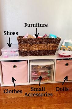 an organized toy storage unit with pink bins and baskets labeled on the bottom shelf