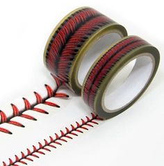 two rolls of red and black washi tape sitting next to each other on a white surface