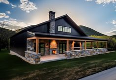 a large house with a stone fireplace in the middle of it's front yard