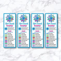 three girls scout bookmarks on a marble background with the words girl scout written below them