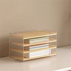 a stack of books sitting on top of a white table