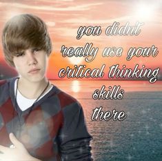 a young man standing in front of the ocean with an inspirational quote on his chest