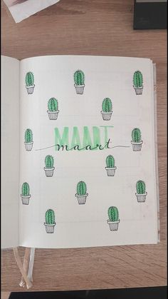 an open notebook with the word madi written in green ink on top of it