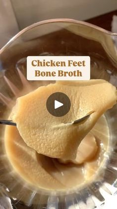 chicken feet in bone broth being spooned into a glass bowl with the text chicken feet bone broth on it