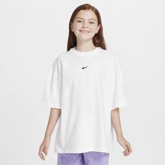 Classic Nike style? Check. A baggy fit that feels oh-so comfortable? Check. Made from midweight cotton that feels soft and has a slight drape, this tee has extra room in the body and sleeves to give you the space you need to dive into whatever adventure comes next. Nike Oversized T-shirt For Streetwear, Oversized Sports T-shirt For Spring, Nike White Top For Loungewear, Nike White Tops For Loungewear, Oversized Short Sleeve Sportswear Tops, Oversized Sportswear T-shirt For Sports, Sporty Boxy Fit T-shirt For Sports, Oversized Cotton Tops For Sportswear, Nike Cotton Oversized Tops