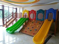 children's play area with slide and climbing wall