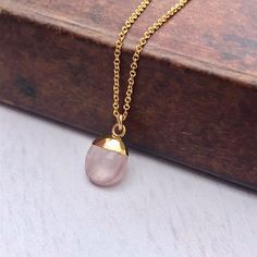 Rose Quartz Necklace, Rose Quartz Oval Pendant, Blush Pink Gold Necklace, Neutral Minimalist Layering Jewelry, Pink Jewelry Gift for women This simple dainty necklace features a tiny genuine rose quartz oval pendant dipped in your choice of 14k Gold Filled or Sterling Silver. The blush pink pendant is suspended from a delicate chain in the finish of your choice. This is a 100% rose quartz gemstone, full of healing properties. This necklace is simply perfect for everyday wear and is perfect for l Rose Quartz Gold Necklace, Rose Pink Necklace, Rose Quartz Properties, Pink Gold Necklace, Layering Jewelry, Pink Pendant, Rose Quartz Jewelry, Rose Gold Quartz, Neutral Minimalist